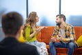 Young couple having an argument during the psychotherapeutic session Royalty Free Stock Photo