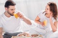 young couple having breakfast in bed Royalty Free Stock Photo