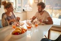 A young couple having a breakfast at home together. Relationship, love, together, breakfast Royalty Free Stock Photo