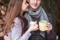 Young couple having breakfast in a romantic cabin outdoors in winter. Winter holiday and vacation. Christmas couple of