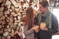 Young couple having breakfast in a romantic cabin outdoors in winter. Winter holiday and vacation. Christmas couple of