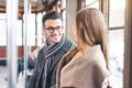 Young couple having a conversation while sitting inside vintage tram transport - Happy people talking during a journey in bus Royalty Free Stock Photo