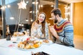 Couple celebrating winter holidays indoors Royalty Free Stock Photo