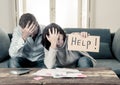 Young Couple having financial problems feeling stressed paying bills debts mortgage asking for help Royalty Free Stock Photo