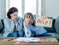 Young Couple having financial problems feeling stressed paying bills debts mortgage asking for help Royalty Free Stock Photo