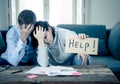 Young Couple having financial problems feeling stressed paying bills debts mortgage asking for help Royalty Free Stock Photo