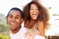 Young Couple Having Fun On Beach Holiday Together Royalty Free Stock Photo