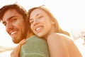 Young Couple Having Fun On Beach Holiday Together Royalty Free Stock Photo