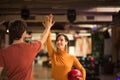 Young couple having fun in bowling alley. Royalty Free Stock Photo