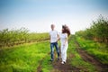 Young couple having fun on the cherry garden in the spring Royalty Free Stock Photo