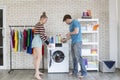 Young Couple having fun while doing spring cleaning together in their house. Couple at home having fun while doing household chore Royalty Free Stock Photo