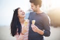 Young couple having fun with ice cream cones Royalty Free Stock Photo