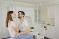 Young couple having fun in the kitchen.