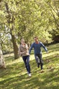 Young couple having fun in park Royalty Free Stock Photo