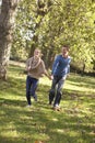 Young couple having fun in park Royalty Free Stock Photo