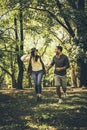 Happy couple outdoor. Walking trough woodland. Royalty Free Stock Photo