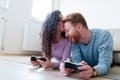 Young couple having fun playing video games Royalty Free Stock Photo