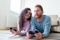 Young couple having fun playing video games Royalty Free Stock Photo