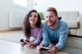 Young couple having fun playing video games Royalty Free Stock Photo