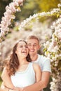 Young couple having fun in a sunny park in springtime Royalty Free Stock Photo