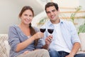 Young couple having a glass of red wine Royalty Free Stock Photo
