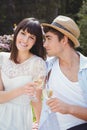 Young couple having glass of wine in garden Royalty Free Stock Photo