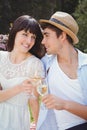 Young couple having glass of wine in garden Royalty Free Stock Photo