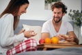A young couple having a good time while having a breakfast in the bed. Love, relationship, together Royalty Free Stock Photo