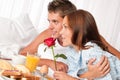 Young couple having luxury hotel breakfast