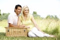 Young couple having picnic in countryside Royalty Free Stock Photo