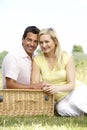 Young couple having picnic in countryside Royalty Free Stock Photo