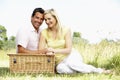 Young couple having picnic in countryside Royalty Free Stock Photo