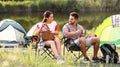 Young couple having picnic near tent Royalty Free Stock Photo