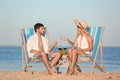 Young couple having picnic with wine and grapes Royalty Free Stock Photo