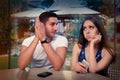 Young Couple Having Problems with Their Smart Phones Royalty Free Stock Photo