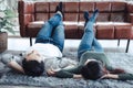Young Couple Having Relaxing While Lying on Carpet at Their Home, Attractive Asian Couple Love are Relaxed Together at Home Living Royalty Free Stock Photo