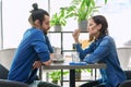 Young couple having serious conversation while sitting together in cafe Royalty Free Stock Photo