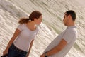 Young couple having a serious talk at that oceansi Royalty Free Stock Photo