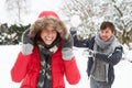 Young couple having snowball fight Royalty Free Stock Photo