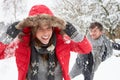 Young couple having snowball fight Royalty Free Stock Photo