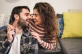 Young couple having tender moments during quarantine isolation - Happy people chilling at home - Domestic lifestyle and