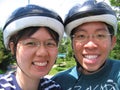 Young couple with helmets Royalty Free Stock Photo