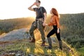 young couple hikers holding hands together, enjoying beautiful scenery of nature Royalty Free Stock Photo