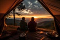 A young couple of hikers sitting and enjoying beautiful view together on sunset or sunrise. Camping, travel, holiday concept. Ai Royalty Free Stock Photo