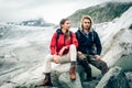 Young Couple Hiking In The Swiss Alps, Taking A Break Royalty Free Stock Photo