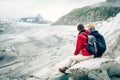 Young Couple Hiking In The Swiss Alps, Taking A Break Royalty Free Stock Photo