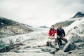 Young Couple Hiking In The Swiss Alps, Taking A Break Royalty Free Stock Photo