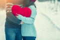 Young couple holding big red heart Royalty Free Stock Photo