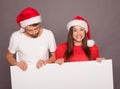 Young couple holding billboard in Christmas Royalty Free Stock Photo