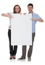 Young couple holding blank placard Royalty Free Stock Photo